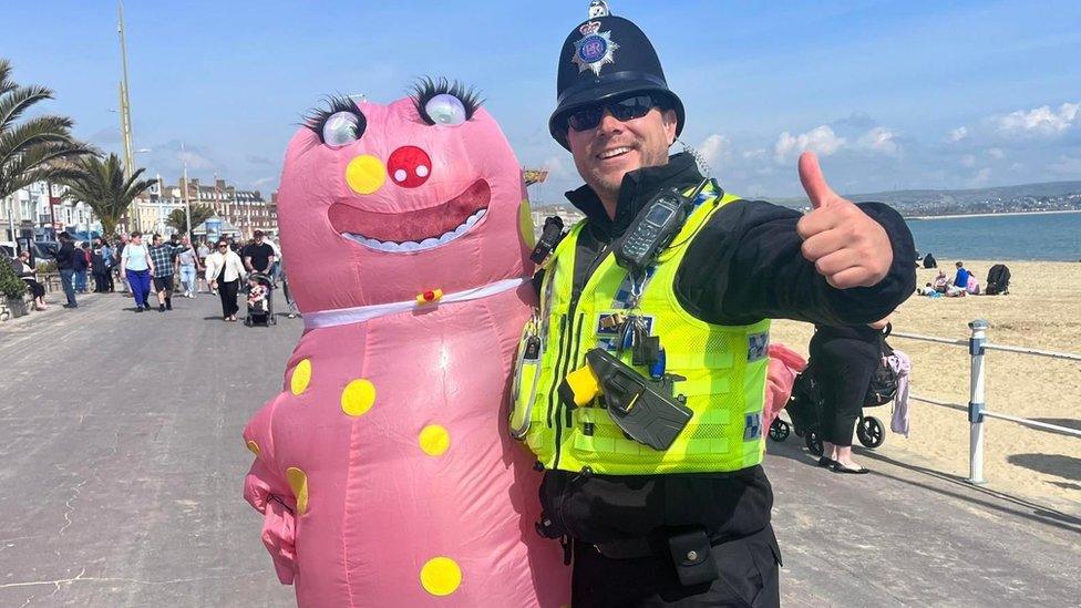 Andy dressed as Mr Blobby for a marathon with a policeman