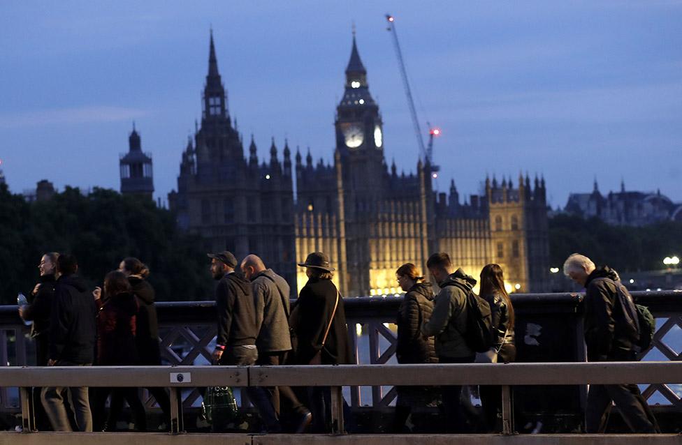 People queue to pay their respects to the Queen at her lying-in-state at Westminster Hall