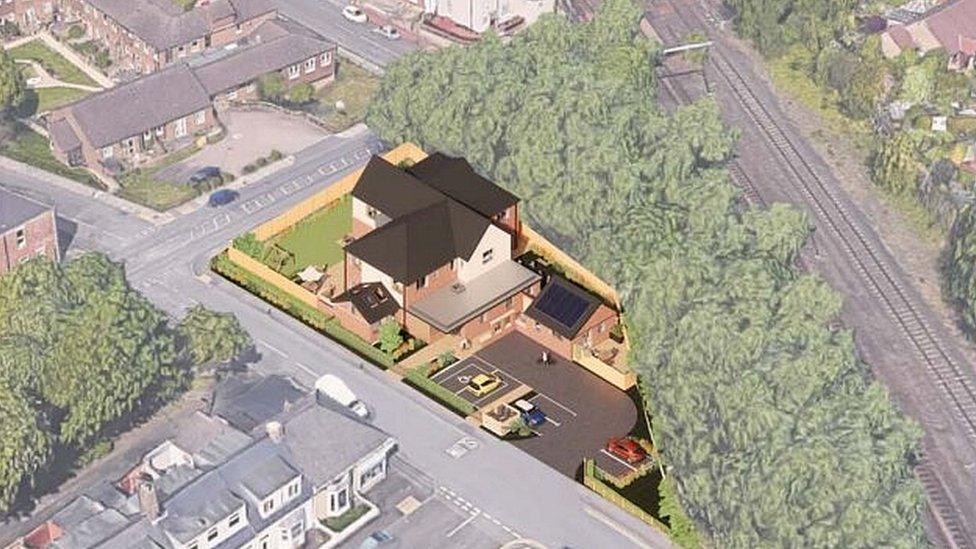 Artist impression of aerial view of a large house