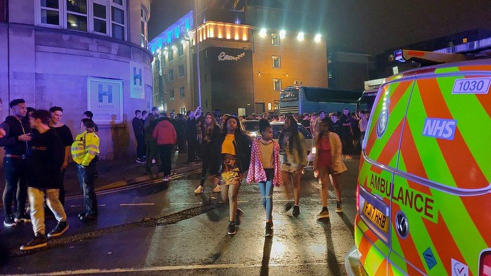 Ambulance and crowds outside Rock City