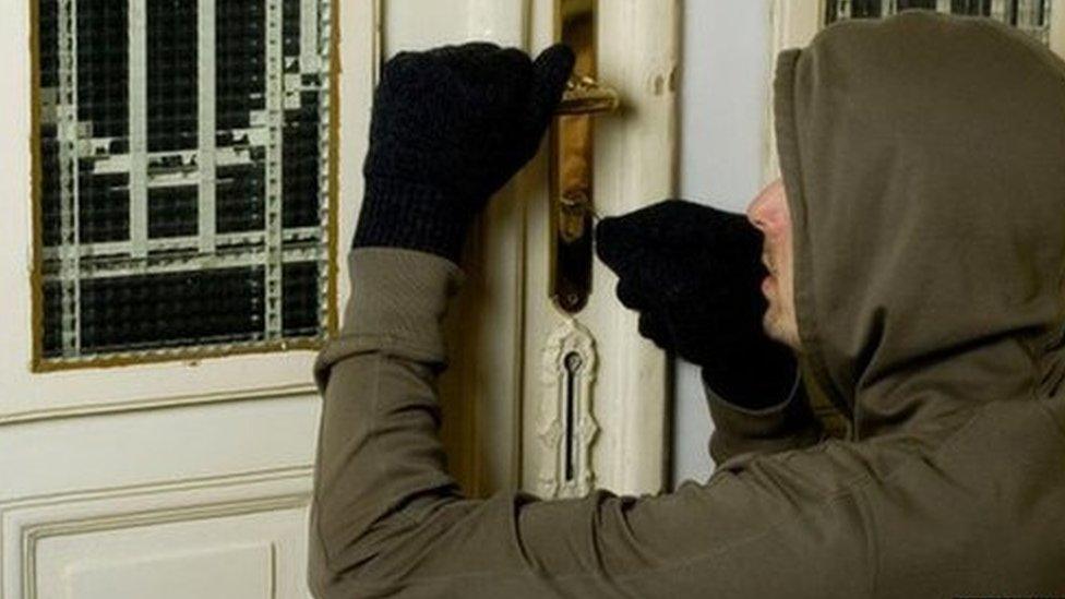 Burglar picking a lock