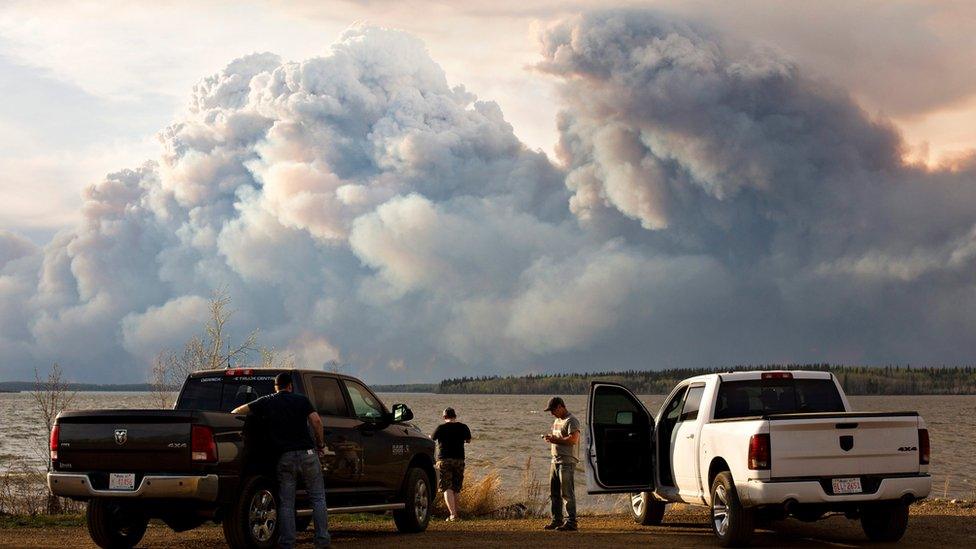 Evacuees watch the wildfire near Fort McMurray, Alberta, on Wednesday, May 4, 2016