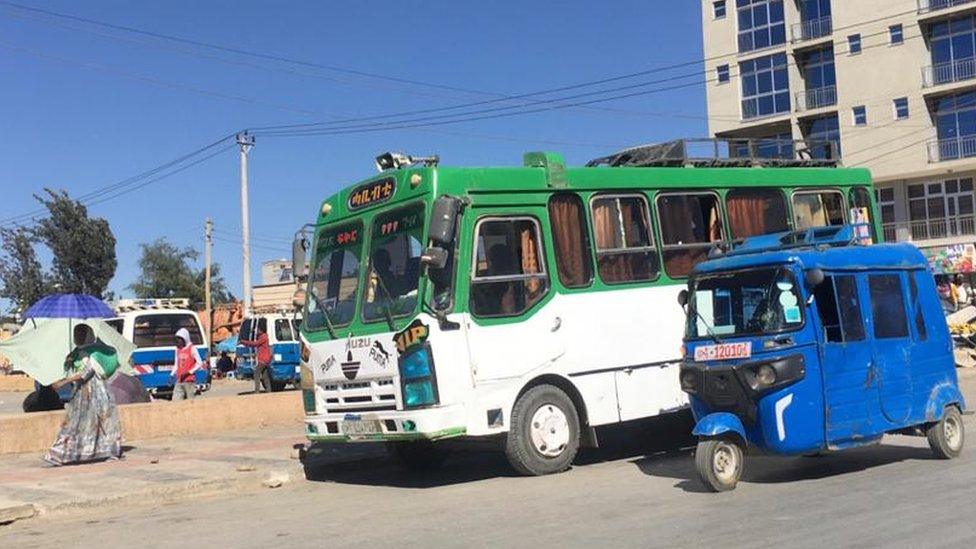 A bus and tuk tuk in Mekelle, Ethiopia - November 2020