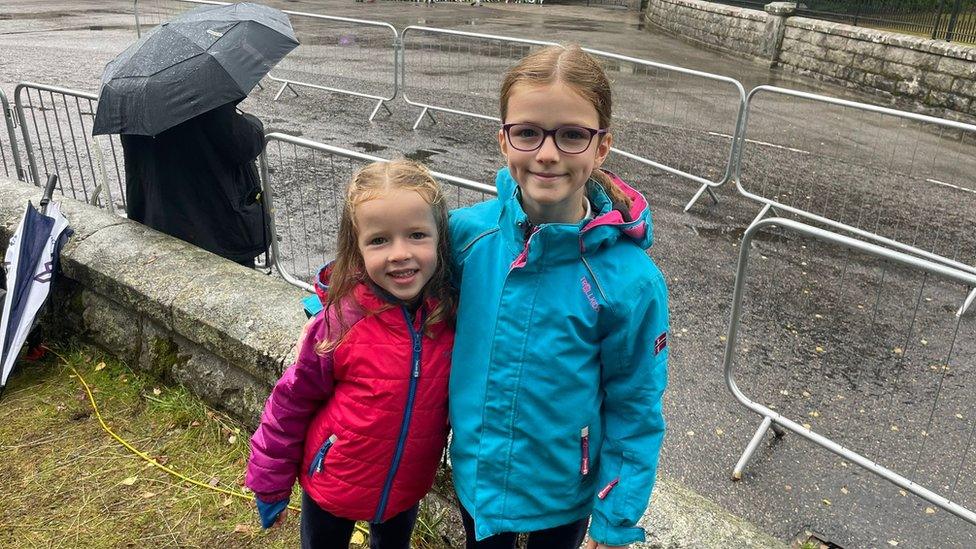 Sophie and Abie came to Balmoral to pay their respects. They wrote a letter and laid down orange roses before heading to school.