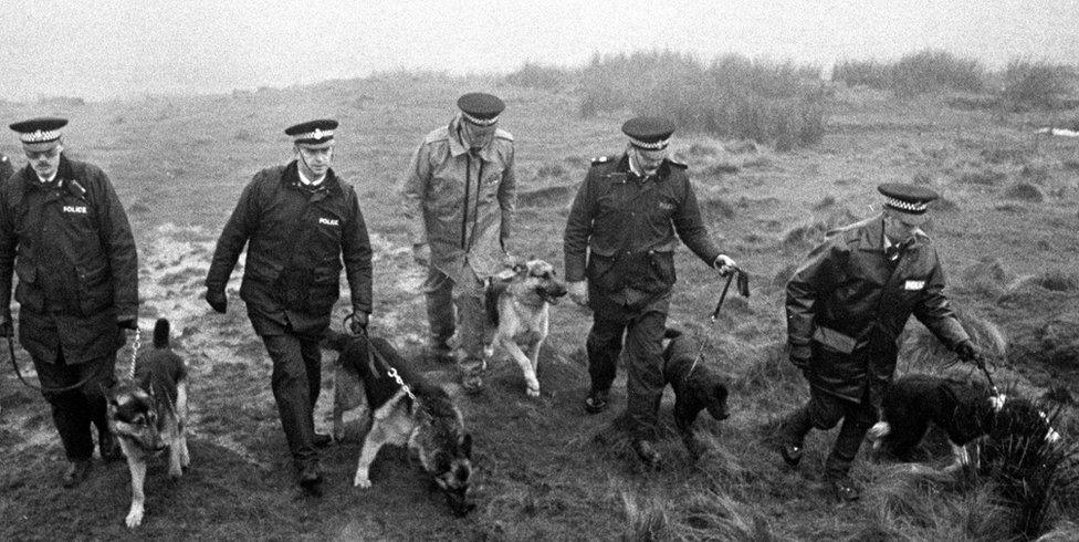 Police with sniffer dogs search Saddleworth Moor for Keith Bennett's body in 1986