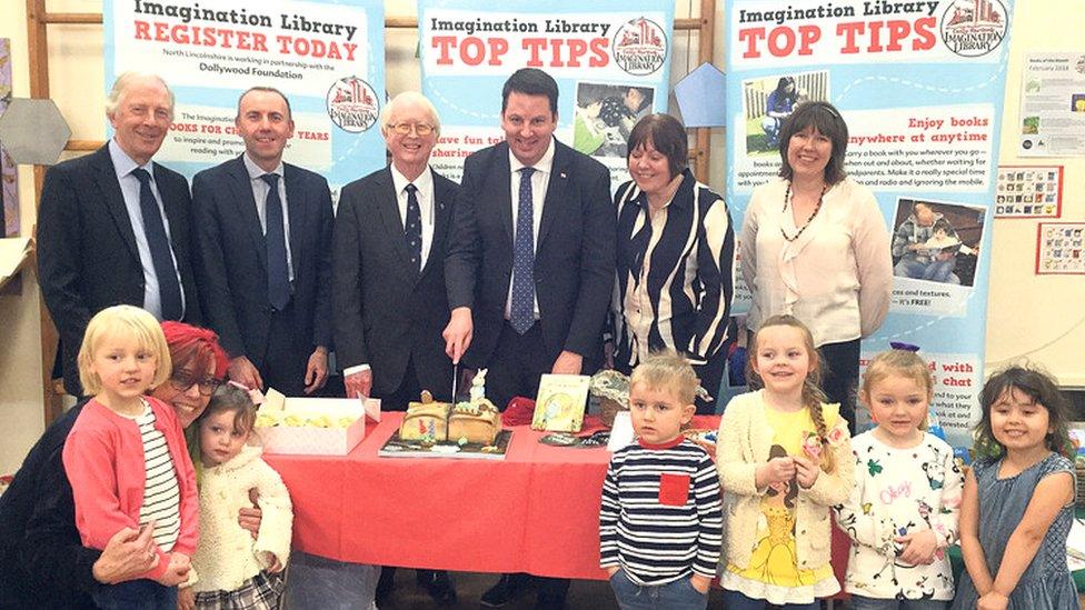 Andrew Percy, Brigg and Goole MP, cuts a cake to celebrate the Imagination Library initative