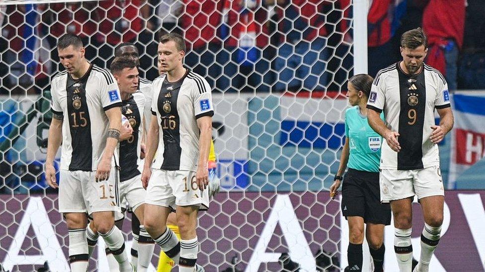 Niklas Suele of Germany, Joshua Kimmich of Germany, Lukas Klostermann of Germany and Niclas Fullkrug of Germany looking sad after conceding their sides second goal during their Group E match