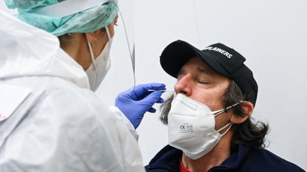 Man being test for covid at Milan's Malpensa Airport