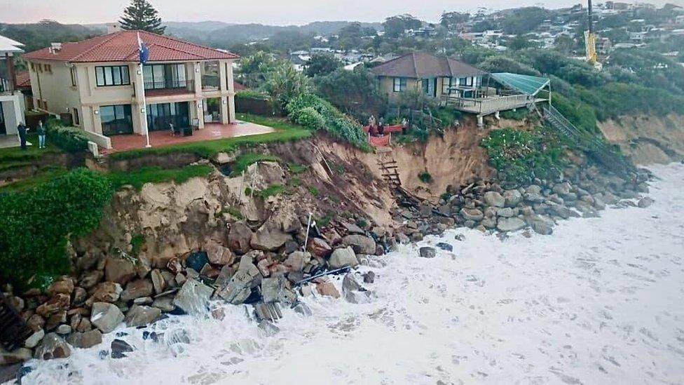 Houses along Warambel Beach which has been wiped away due to the surg