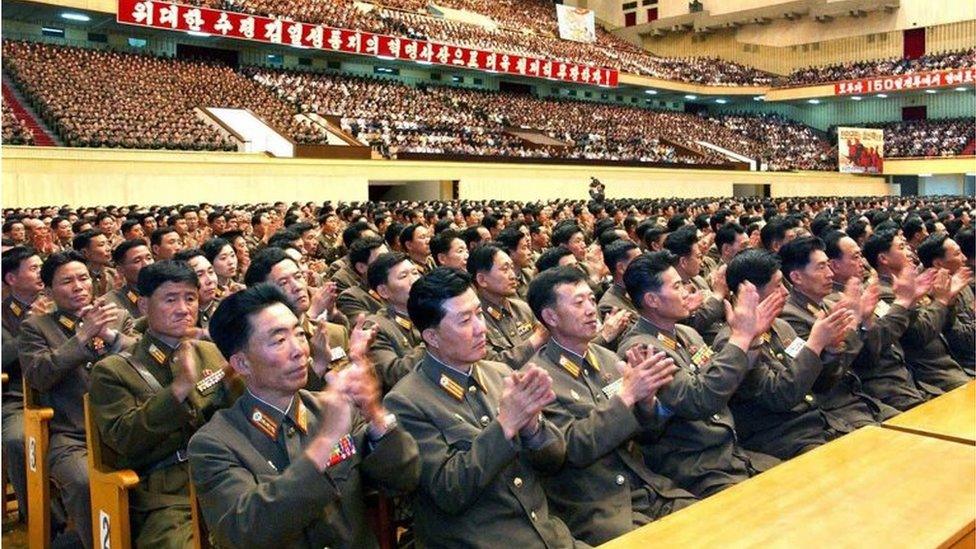 North Korean officials applaud news of a successful nuclear test (27 May 2009)