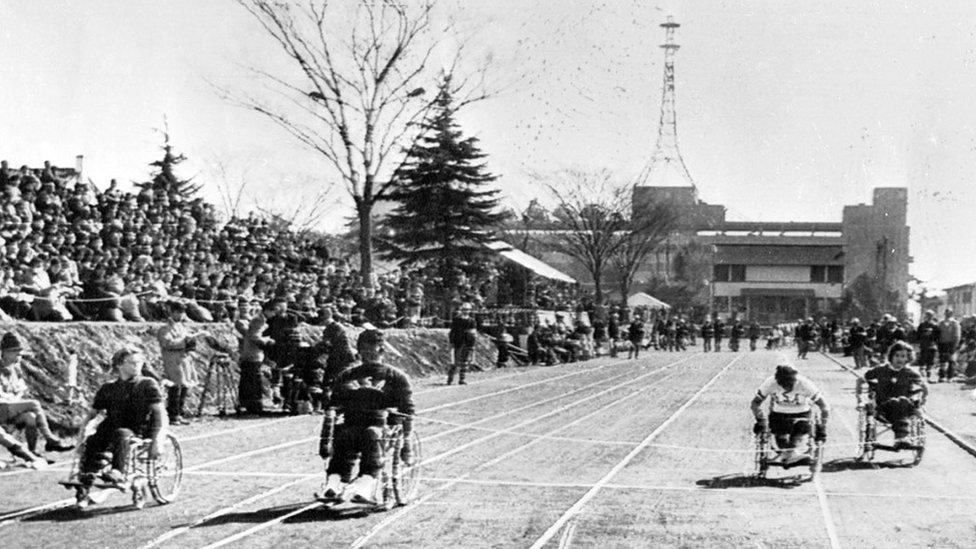 Caz Walton (L) wins gold in the Women's 60m wheelchair dash in Tokyo. Others L-r are Lola Patterson (2nd) of USA , Miss Welger (3rd) also of USA, and Samer Homer (4th) of Australia.