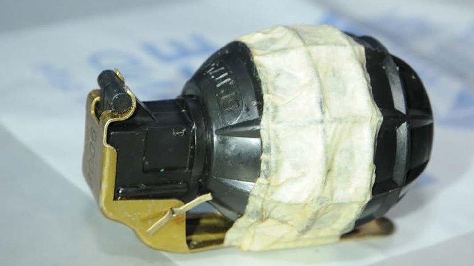 A grenade was among the cache of weapons discovered