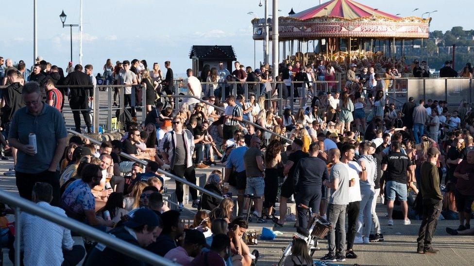 People enjoying sunny weather in Cardiff Bay