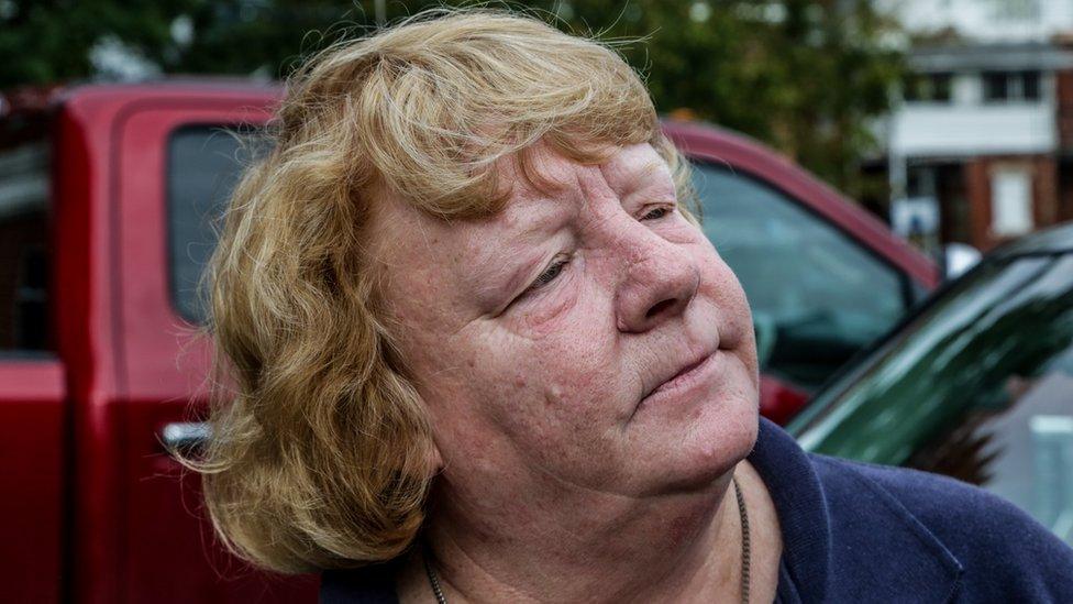 Portrait of Margaret Grassie leaning against car