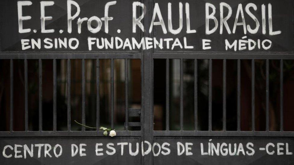 The entrance of Raul Brasil School is seen as students pay homage to victims killed in a shooting, in front of the school in Suzano, Brazil March 14, 2019.