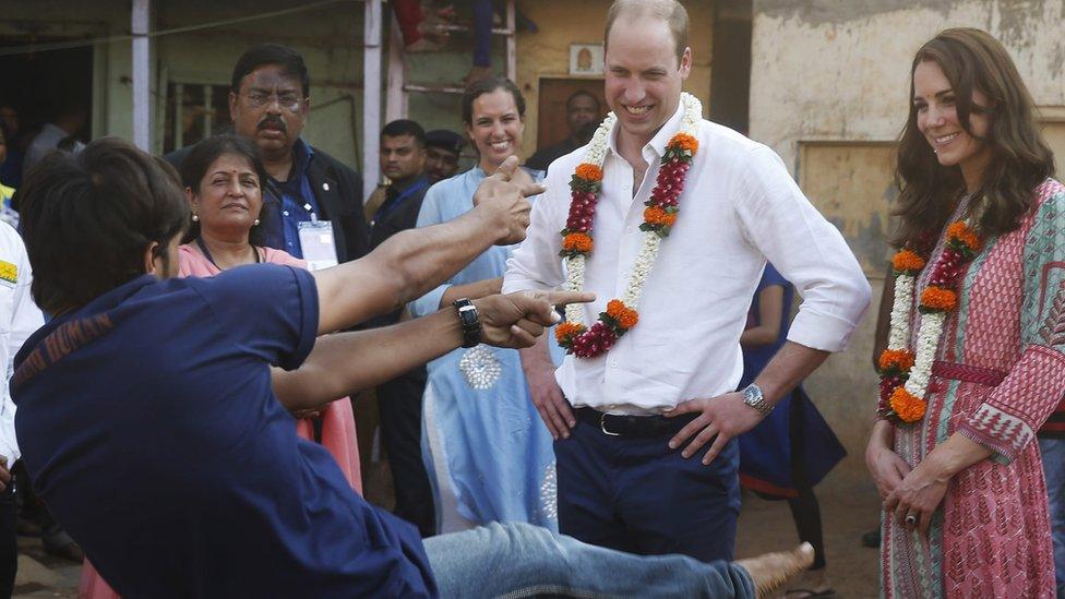 Prince William and his wife the Duchess of Cambridge watch a boy bust a move in Mumbai in India