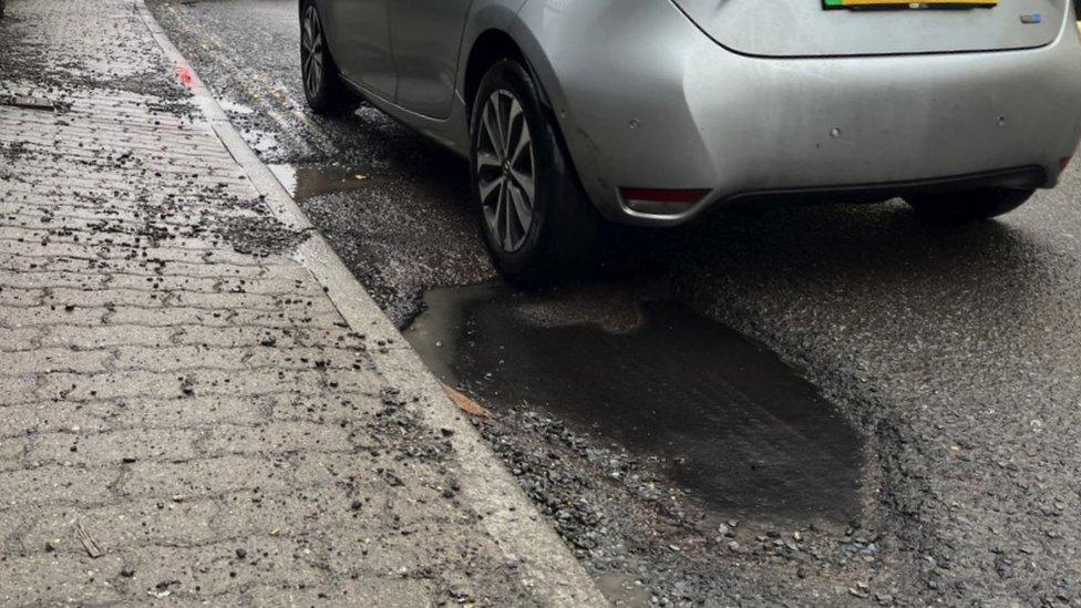 Image of a pothole along Abbey Road in Malmesbury.