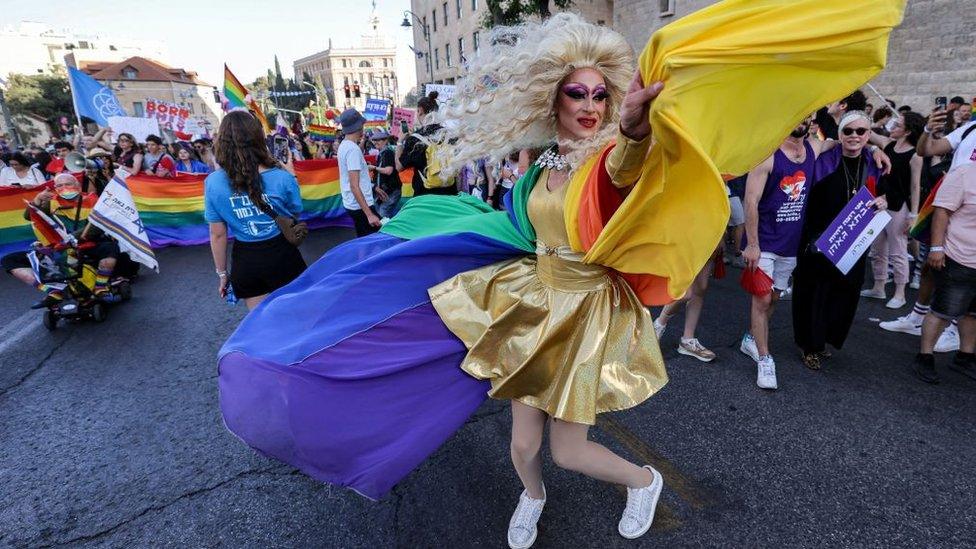 A person dances during the march