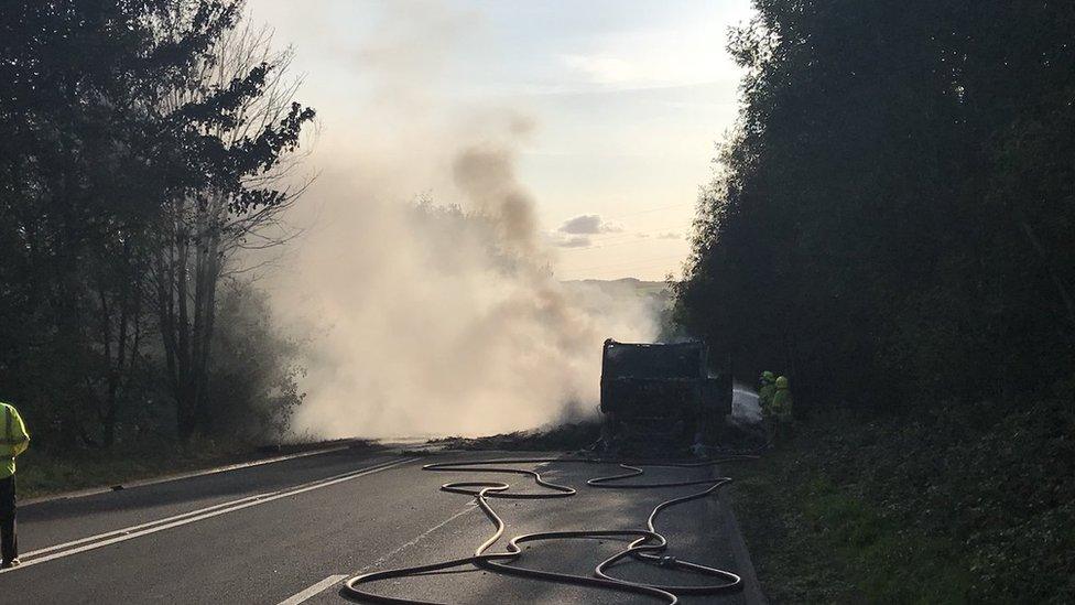 A blackened lorry carcass