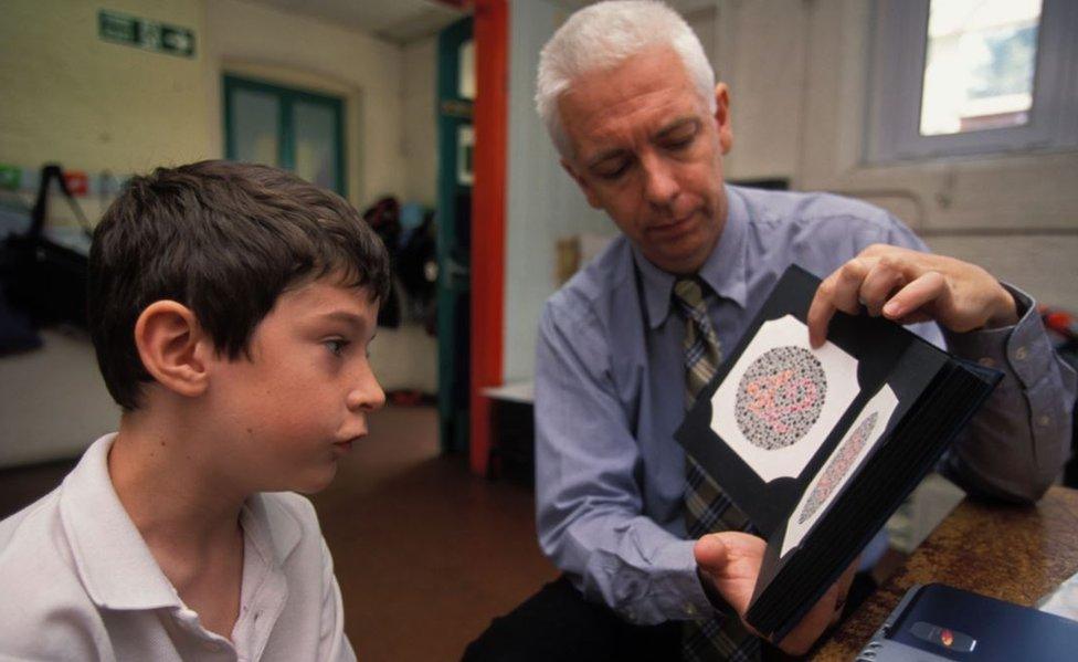 A schoolboy pictured during a colour vision test