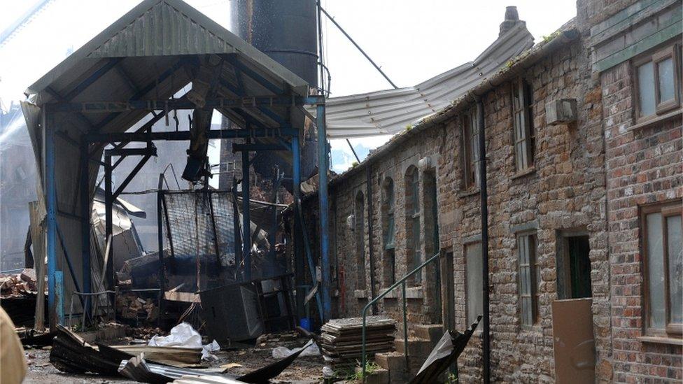 Remains of part of the damaged building at the scene, 18 July 2015