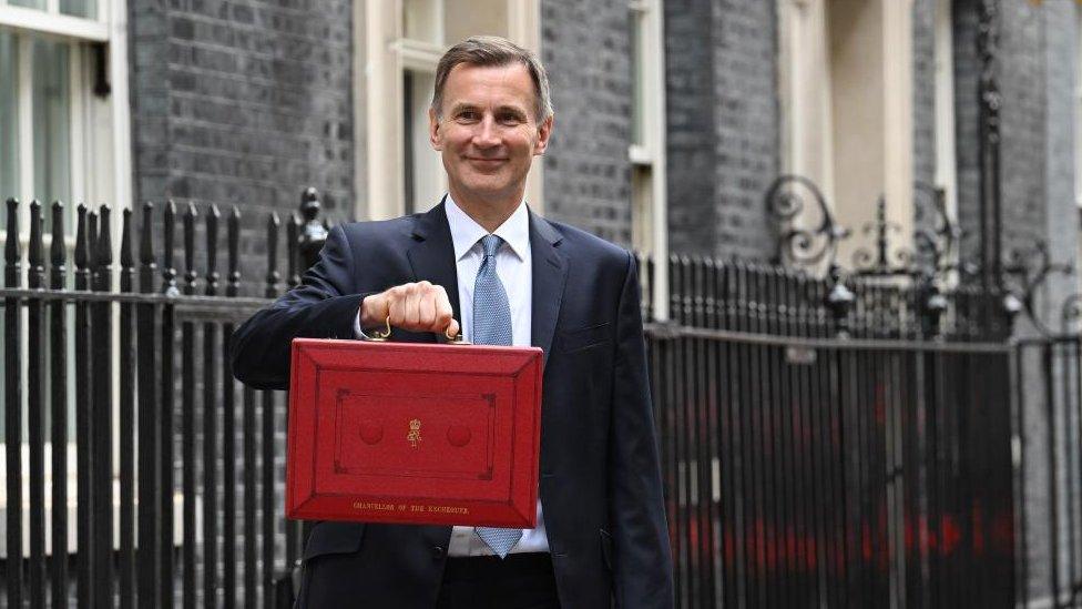 Jeremey Hunt with his red ministerial box on Budget day in March 2023