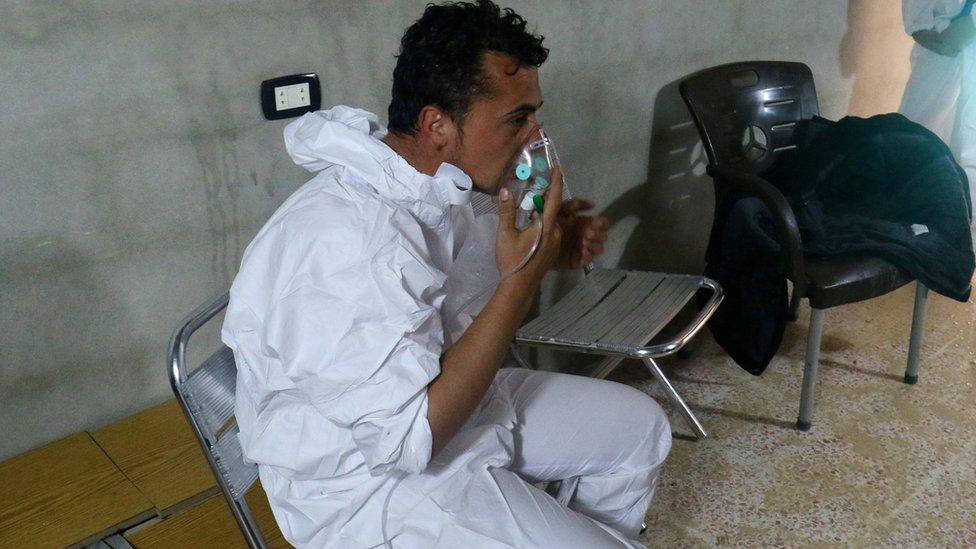 A man breathes through an oxygen mask after what rescue workers described as a suspected gas attack in the town of Khan Sheikhoun in rebel-held Idlib, Syria April 4, 2017.