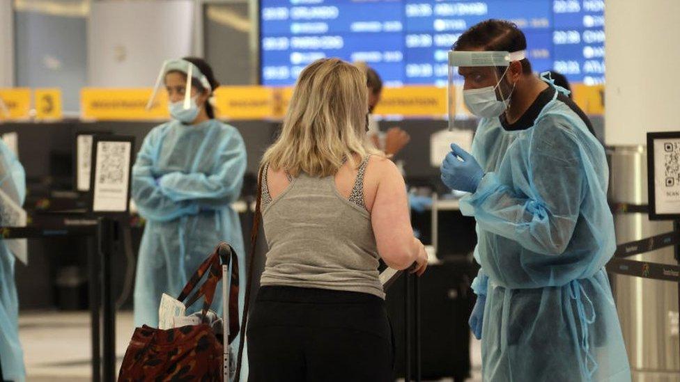 Healthcare workers speaking to a traveller in Canada