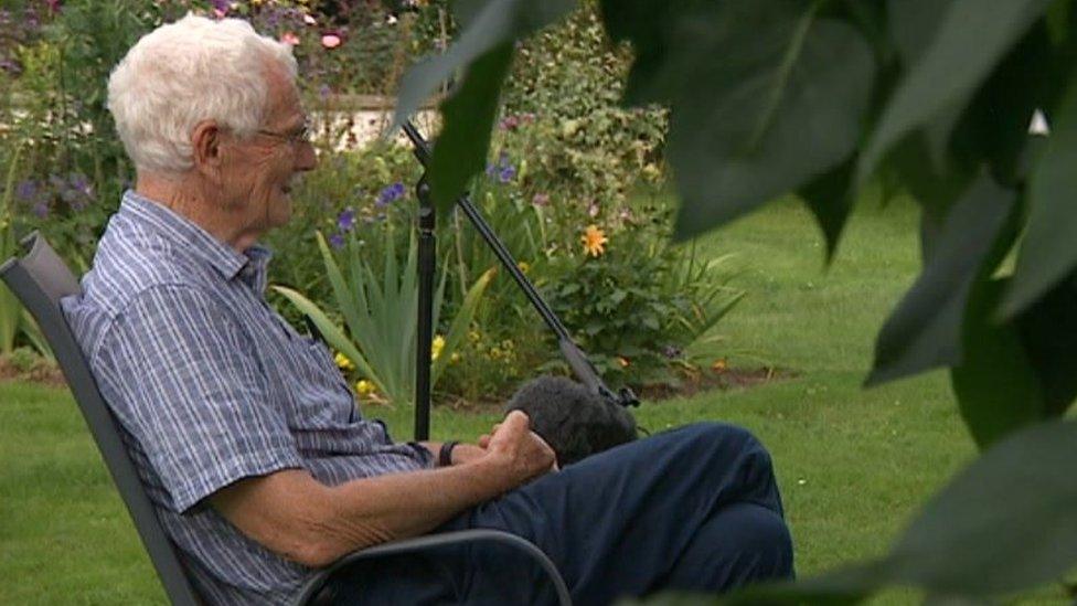 Man sitting in a garden