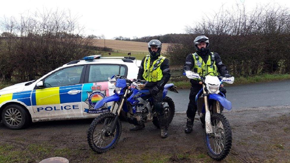 Cleveland Police officers with two of the off-road motorbikes they have seized