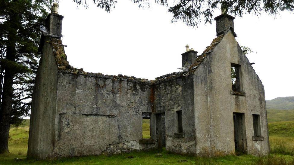 The lodge is just a shell. The roof, doors and windows are gone. A wall and the gable ends are still standing.