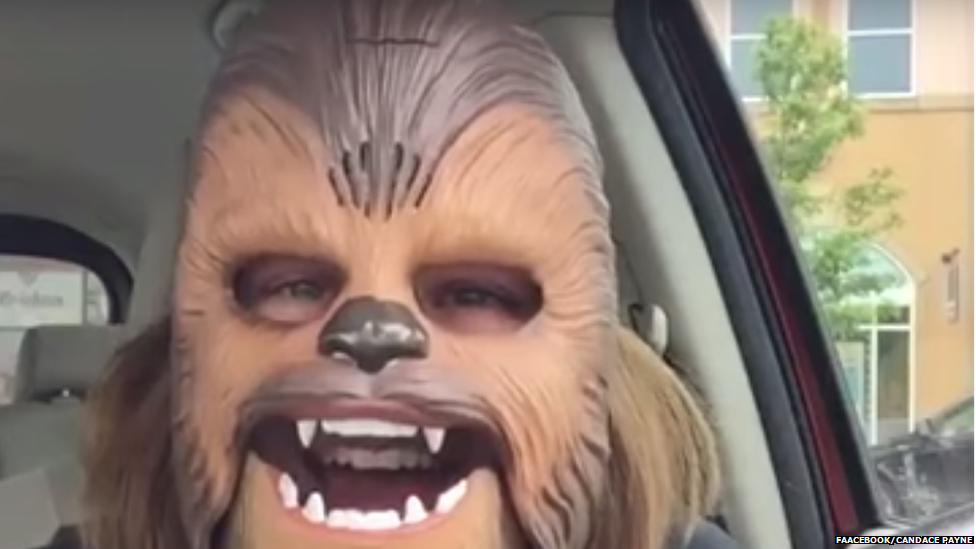 This is a photo of Candace Payne wearing the Star Wars Chewbacca mask.