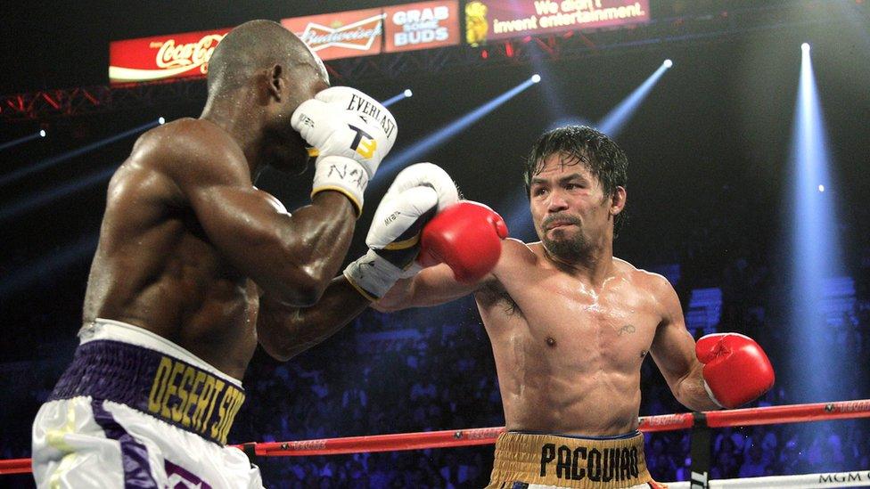 File photo taken on 9 April 2016 shows Manny Pacquiao (right) and Timothy Bradley Jr (left) facing off during their WBO international welterweight title bout at the MGM Grand Arena in Las Vegas, Nevada.