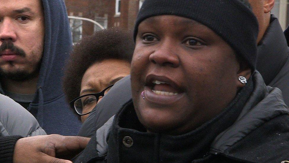 Woman speaking at press conference