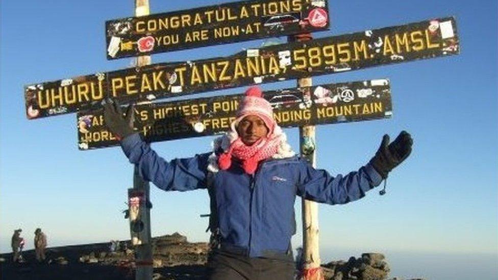 Magid Magid at the summit of Kilimanjaro