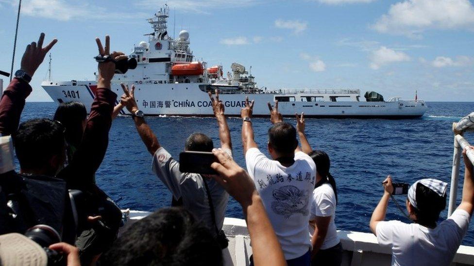 Chinese Coast Guard vessel manoeuvres to block a Philippine government supply ship with members of media aboard at disputed Second Thomas Shoal in South China Sea