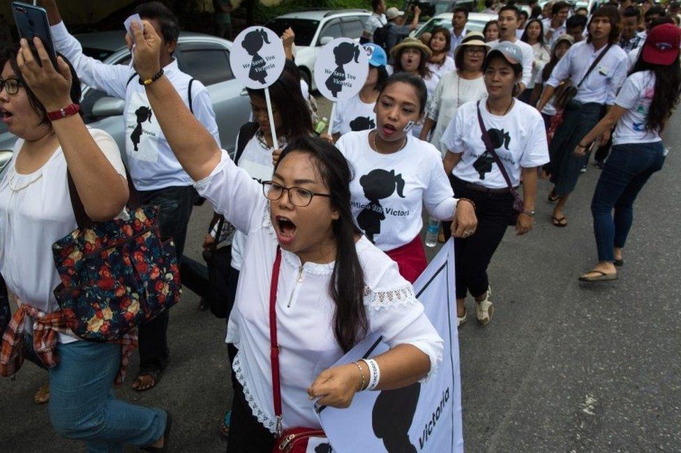 Protesters walk to the Central Investigation Department (CID) during the demonstration demanding justice for a two-year-old who was raped and given the pseudonym "Victoria" in Yangon on July 6, 2019.