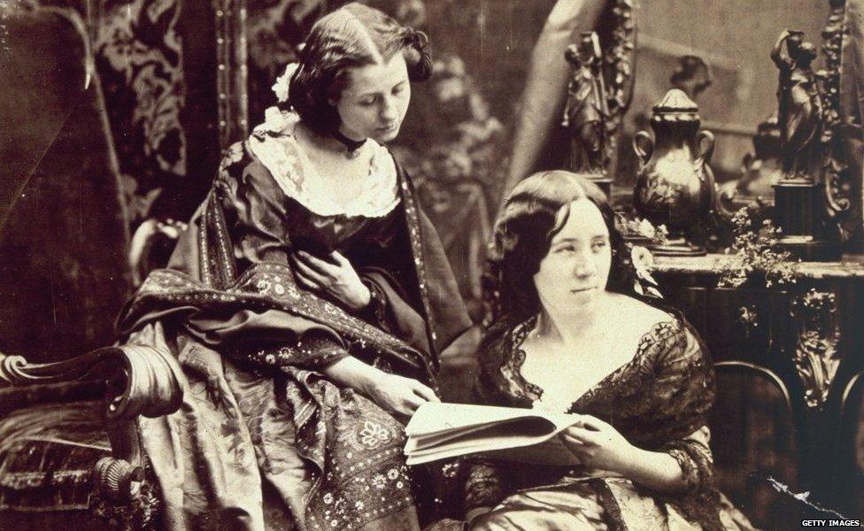 Victorian women sharing a publication