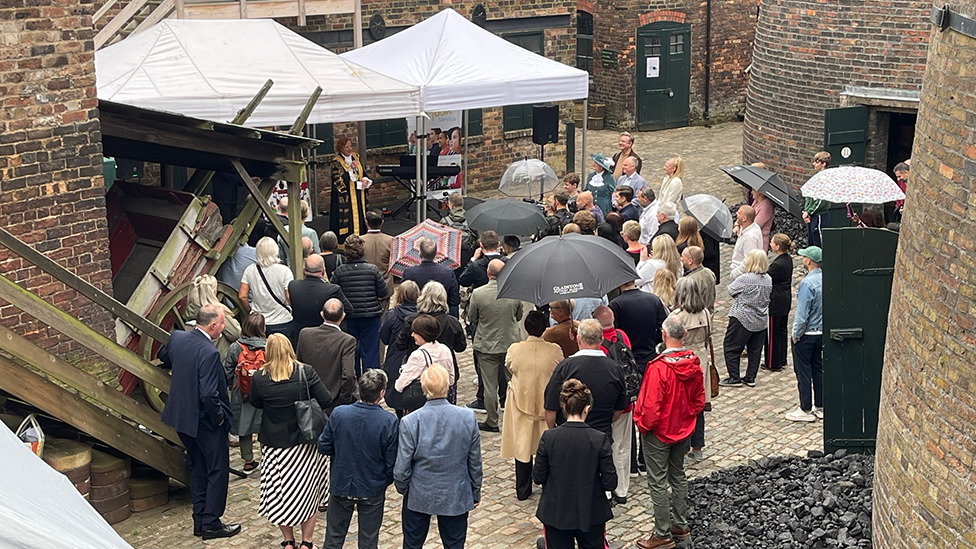 People standing in courtyard of Gladstone Pottery Museum