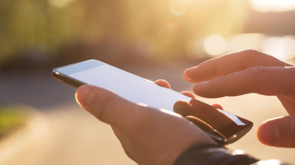 Man using his mobile phone outdoor