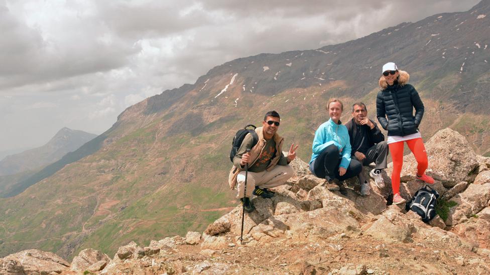 Amy, Kavout and their guides climbing Halgurd, shortly after wandering across an uncleared minefield