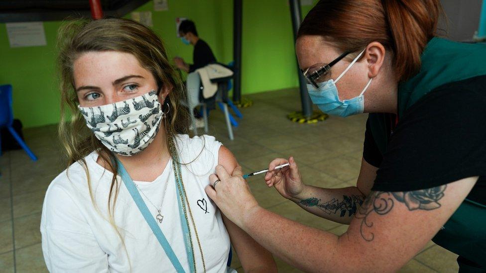 Danielle Stanley, 21 from South Africa receives the Pfizer-BioNTech COVID-19 Vaccine at a new ‘Pop Up’ vaccination service on June 22, 2021 in Newcastle upon Tyne, England.