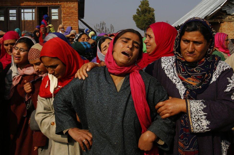 A Kashmiri Muslim woman wails during the funeral of local policeman, Adil Ahmad, on 29 August 2018.