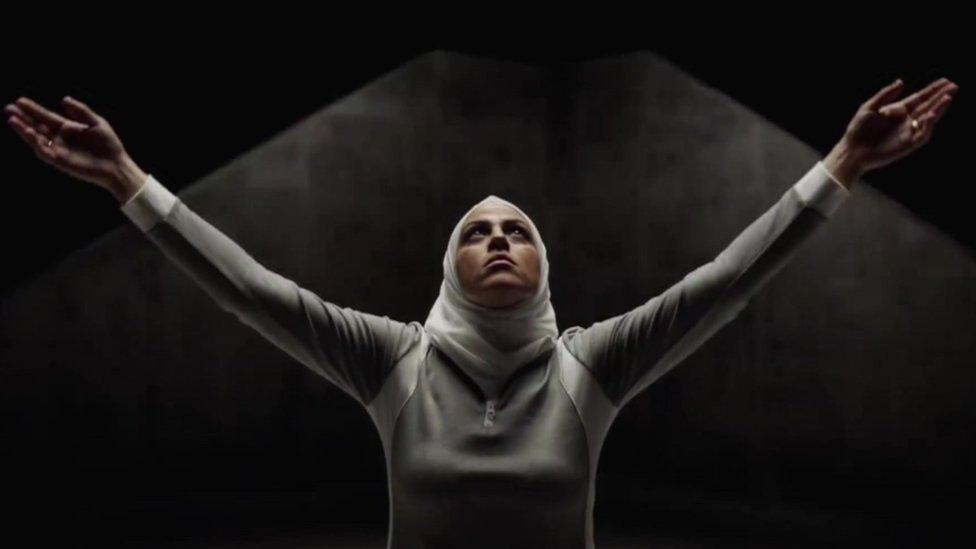 Screen grab from Hoodies ad showing a women in a head scarf