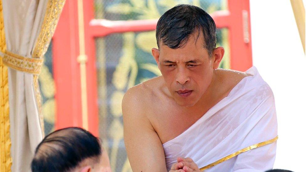 A Royal Household Bureau handout photo shows Thai King Maha Vajiralongkorn Bodindradebayavarangkun bathing with sacred water during the royal purification ablution bath