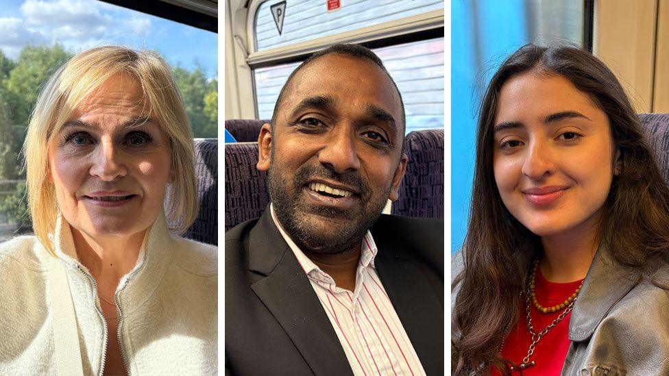 A composite image of three train passengers, each sitting in rail carriages and looking down the camera. From left to right is Natalie Barron, Arvind Kannan and Tala Yunis.
Natalie on the left is smiling slightly and is sitting next to a window. She has short hair cut into a bob and is wearing a thick, white jacket. Trees and blue sky can be seen out the window next to her.
Arvind is smiling with his teeth showing. He is wearing an open-necked white shirt with narrow yellow and red vertical stripes, and a black jacket. He has a short beard and shortly cropped hair. 
Tala is also smiling, though her teeth are not visible. She has long brown straight hair that is falling over her shoulders. She is wearing a grey-green coat over a red top, as well as two necklaces. She is sitting on a train, next to a window. 