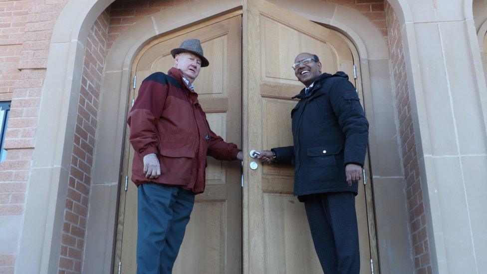 Ian and Tanweer at the door of the new mosque