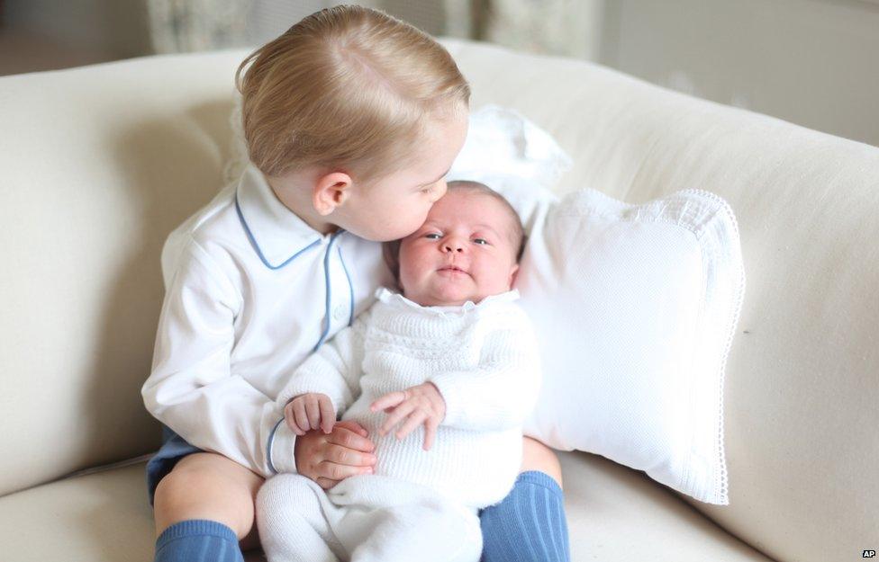 Prince George giving his new little sister a great big kiss and cuddle.