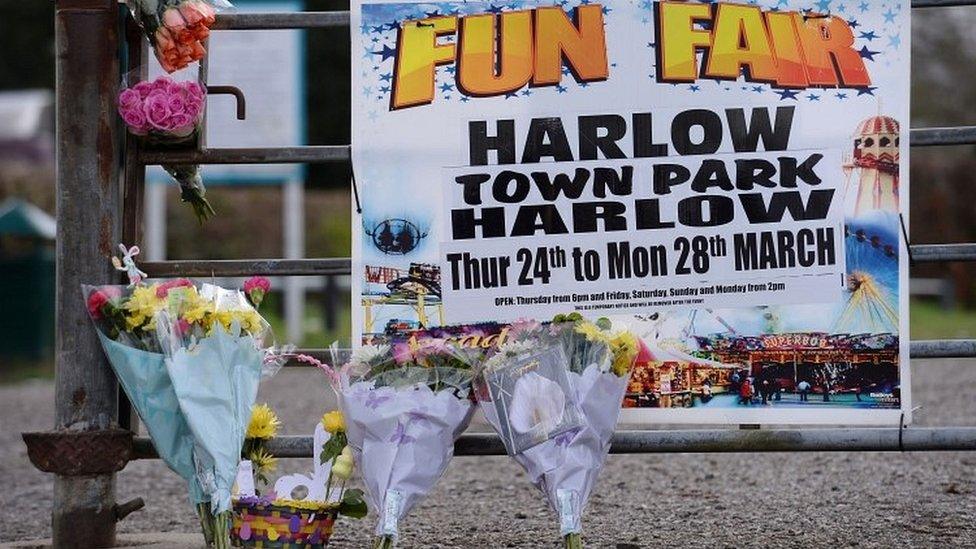 Flowers have been left by the gates of the park, where a fun fair was being held