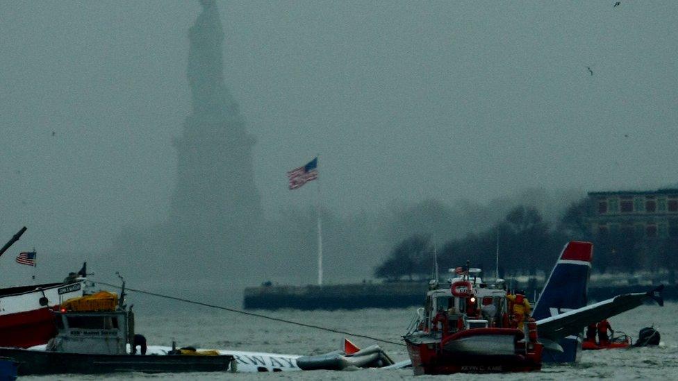 Rescue teams work hard to stop the Us Airways plane from sinking.